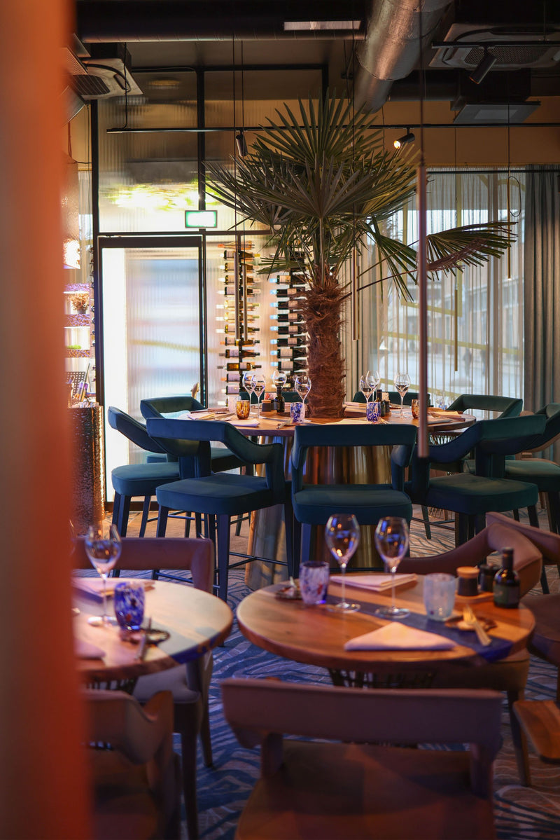 Tall artificial palm tree in a restaurant, bar, lounge, or hospitality interior