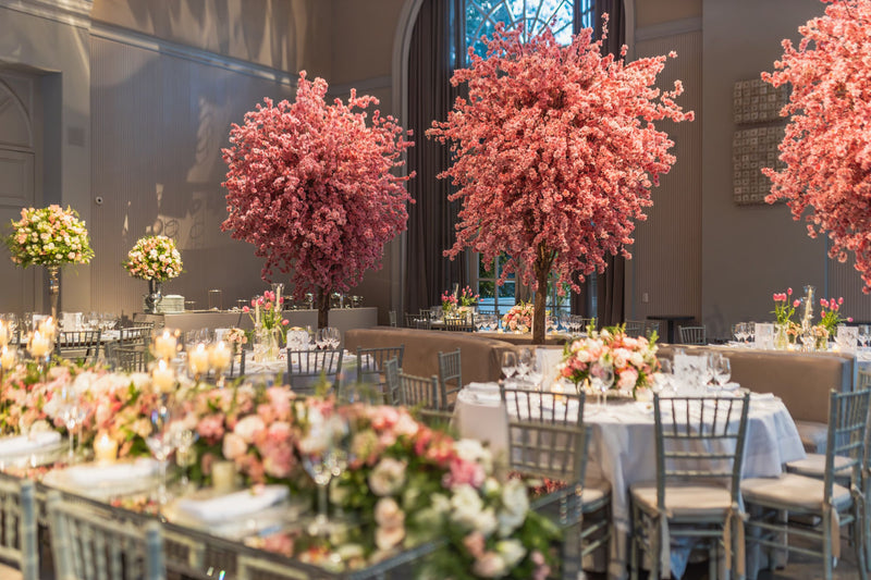 Large artificial cherry blossom tree in a restaurant, event, or private dining setting